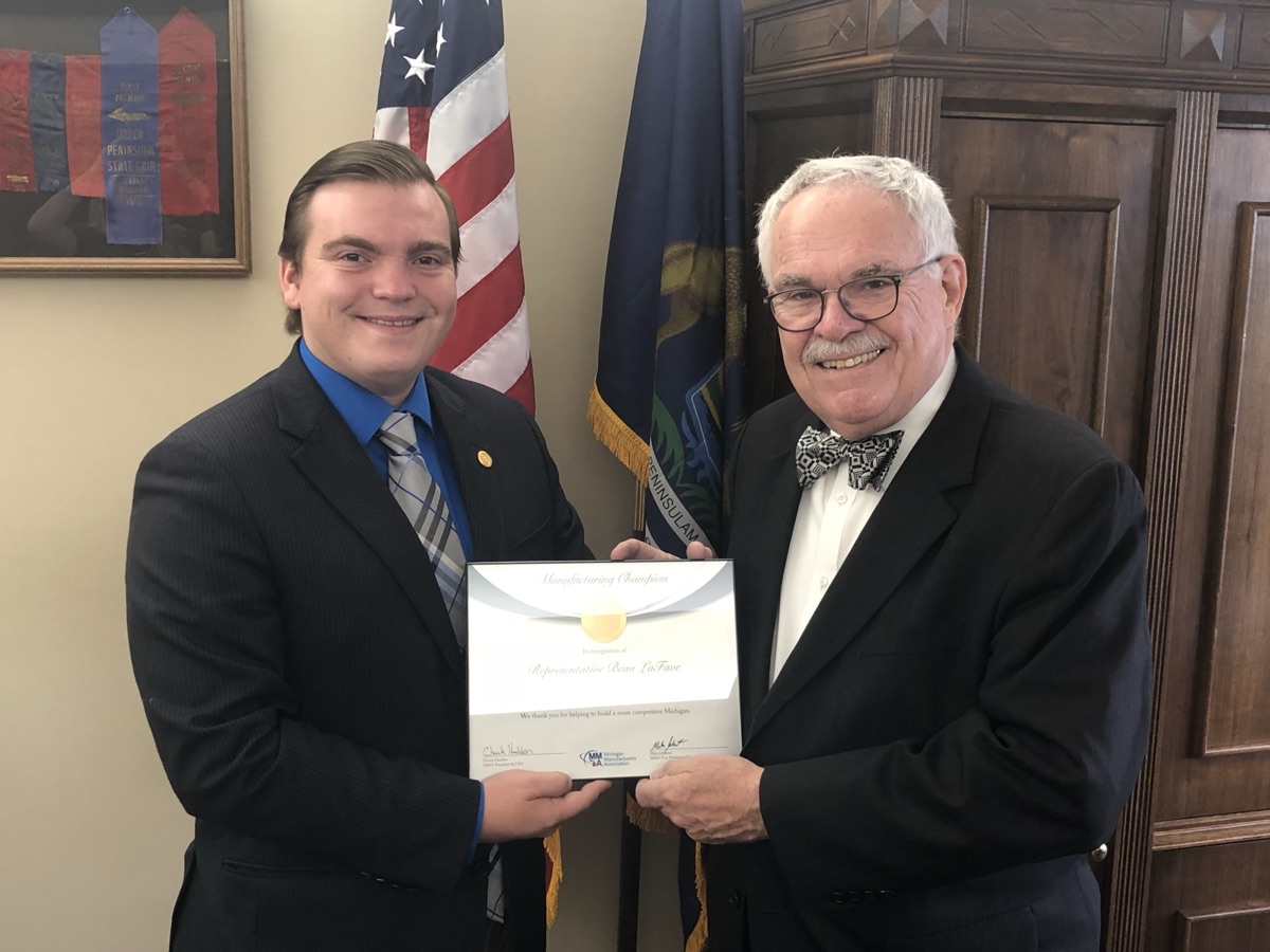 Beau LaFave receiving the Manufacturing Champion award from the Michigan Manufacturers Association
